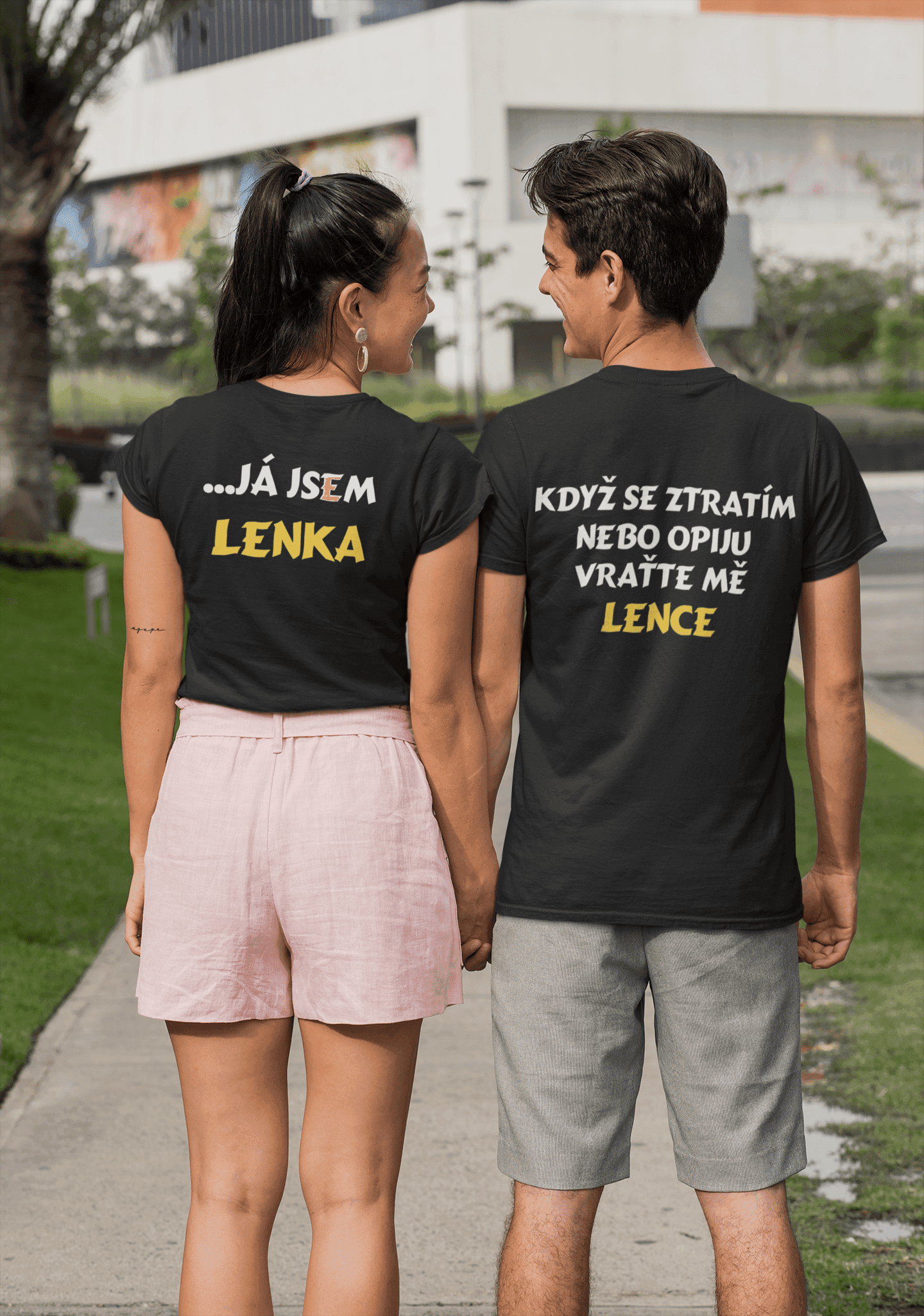 back view mockup of a couple wearing crewneck t shirts on the street 30087 (1) min